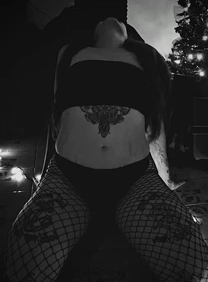 Stripped of warmth, she waits